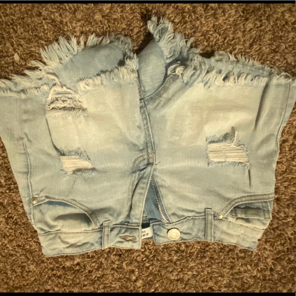 Blue ripped shorts